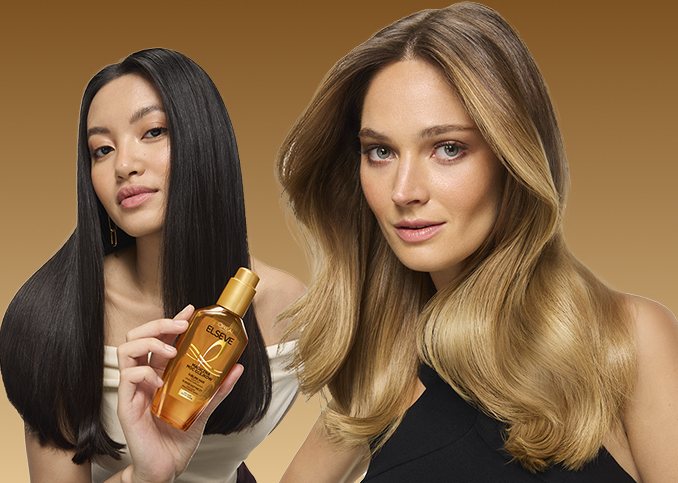 Dwie modelki, jedna z nich trzyma w dłoni olejek Elseve Magiczna Moc Olejków od L’Oréal Paris